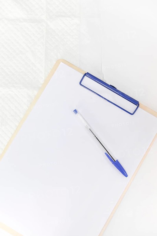 Pen white paper clipboard against white background