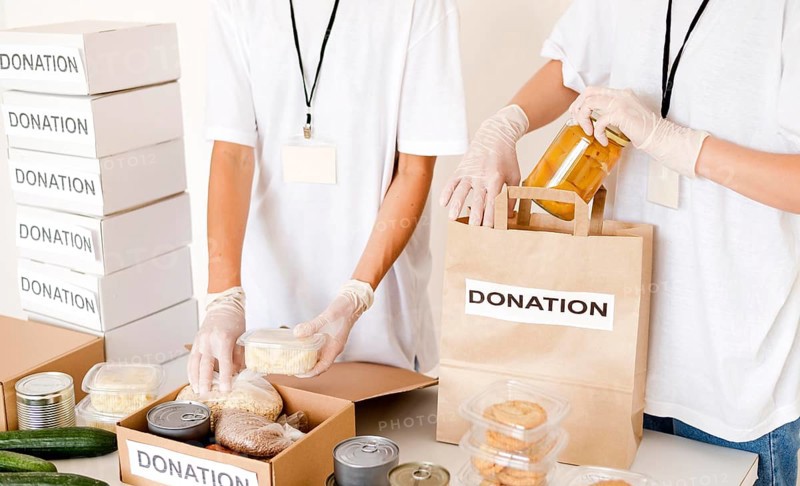 People preparing food box bag donation