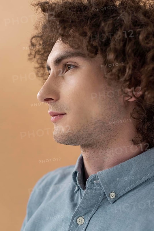 Portrait curly haired young man