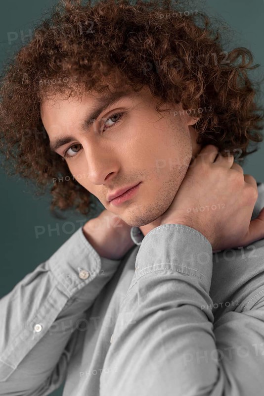Portrait curly haired young man 6