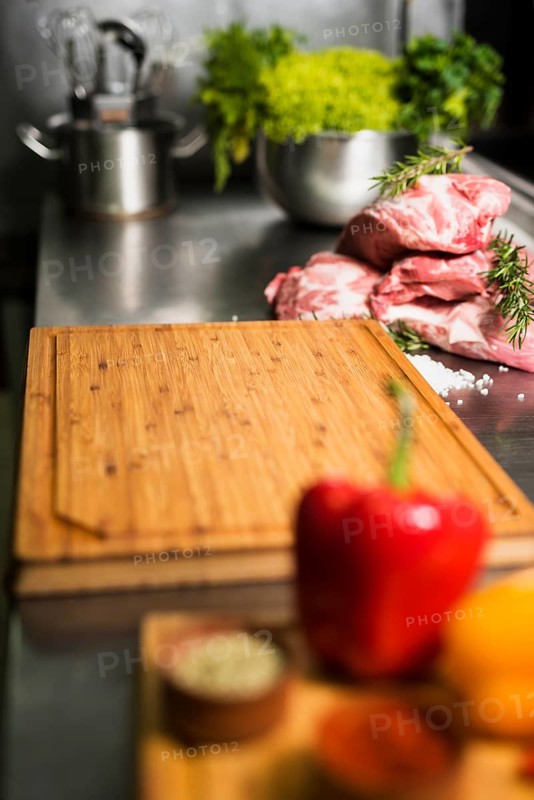 Raw meat steaks with wooden board table