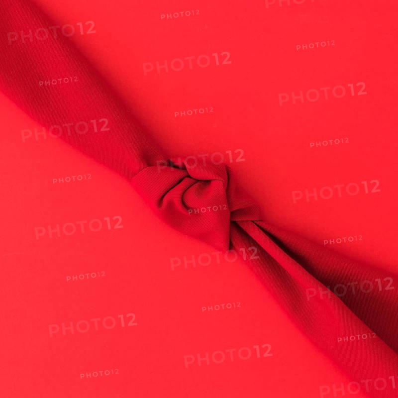 Red knot fabric bright background