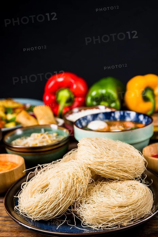 Rice vermicelli plate with thai traditional food against black background