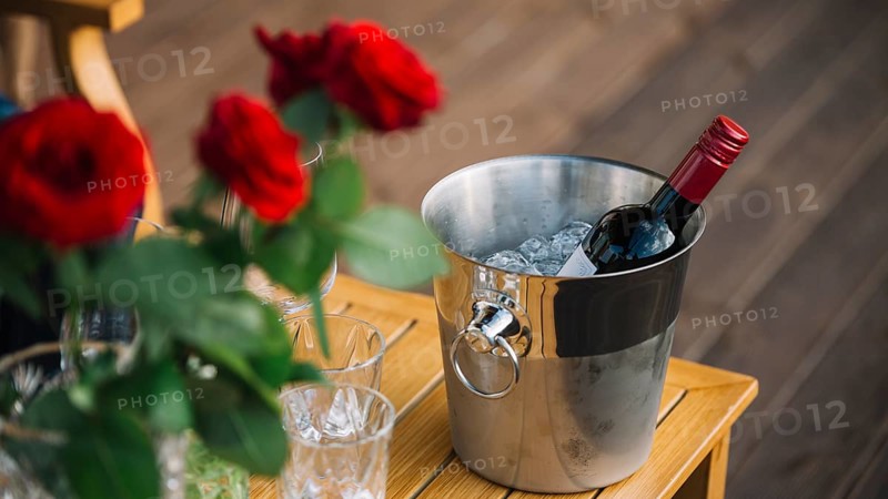 Roses wine bottle ice bucket table