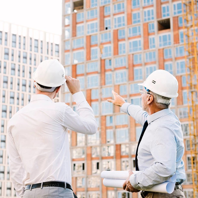 Side view man pointing building scaffolding