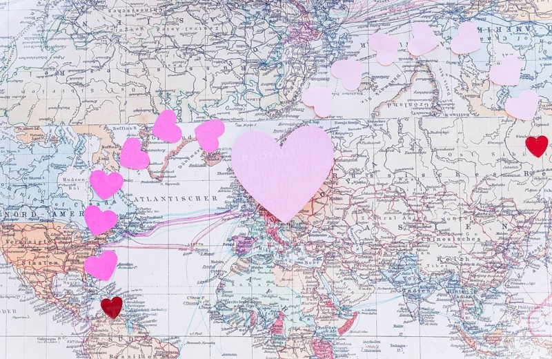 Small colourful paper hearts world map