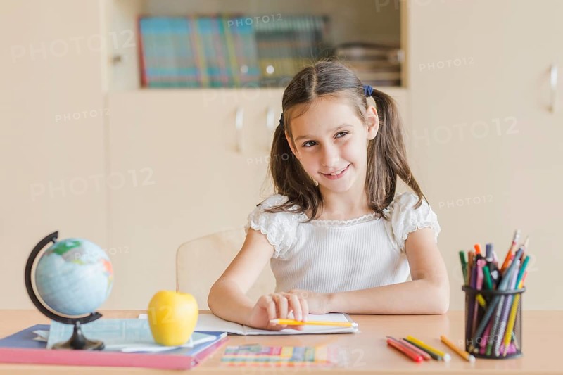 Smiling girl looking away during lesson