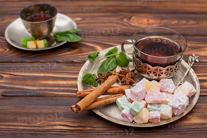 Tea cup with turkish delight wooden table