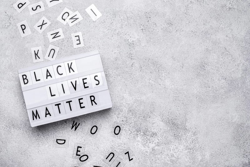 Top view black lives matter light box with letters copy space
