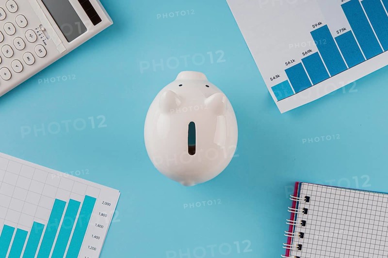 Top view business items with piggy bank growth chart