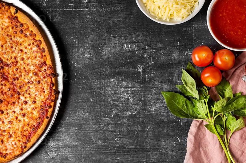 Top view cheese pizza with ingredients copy space