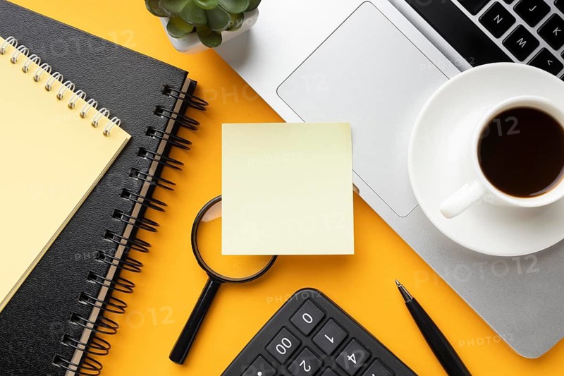 Top view office desk composition with empty post it