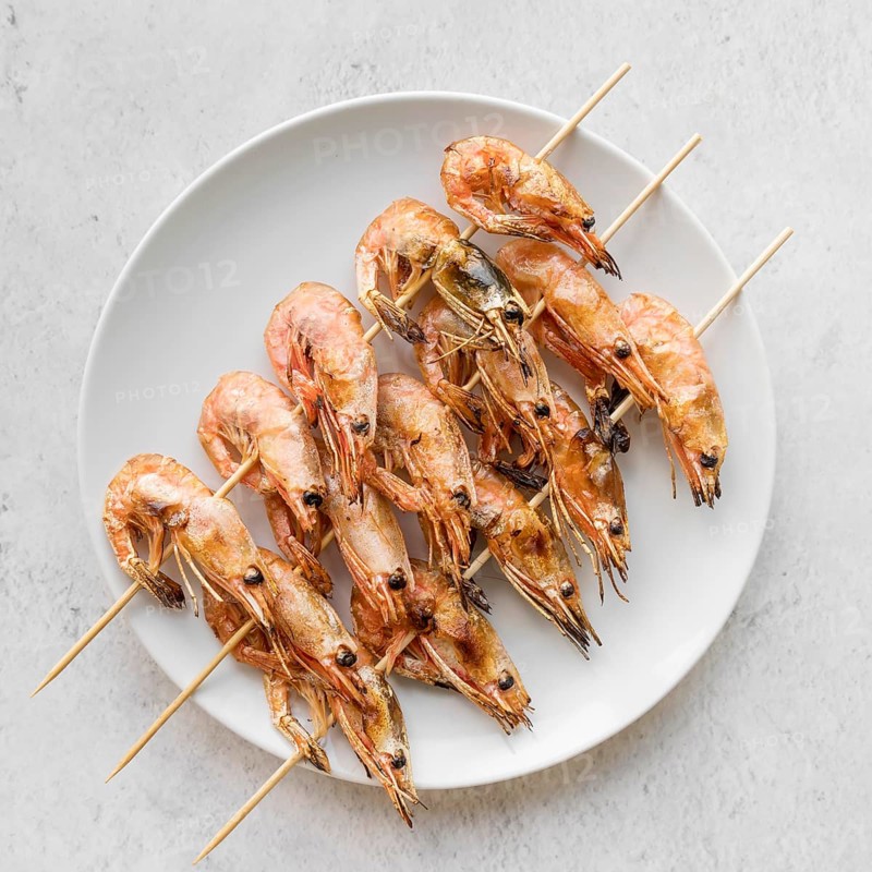 Top view plate with shrimp skewers