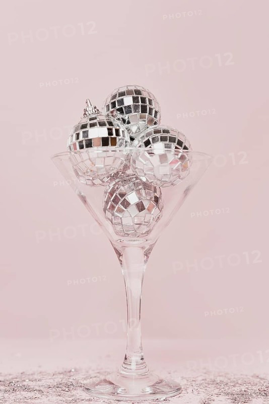 Transparent champagne glass with silver balls