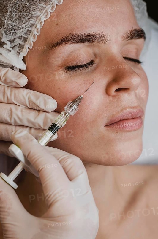 Woman getting facial beauty treatment wellness center
