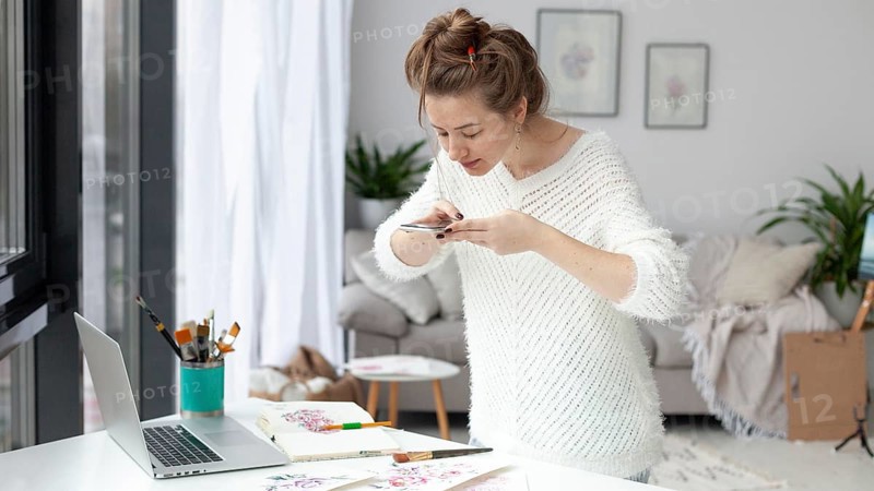 Woman making vlog her drawings