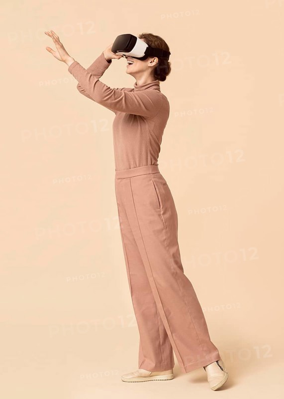 Woman playing virtual reality headset