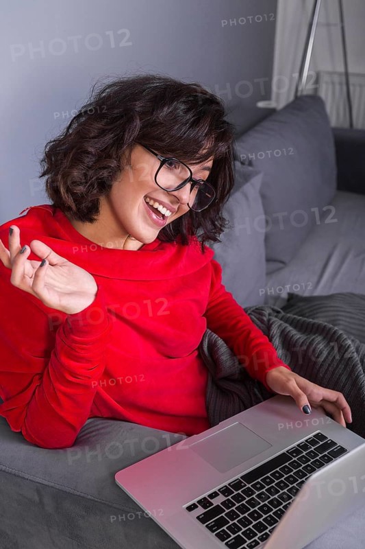 Woman red using laptop