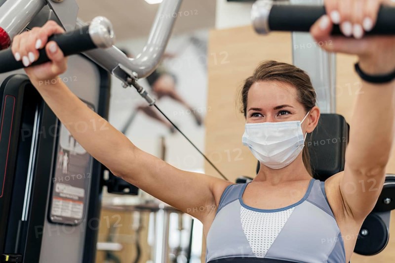 Woman working out gym during pandemic