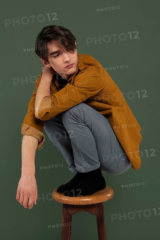 Young man wearing shirt posing chair 2