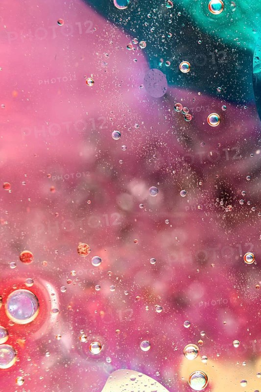 Beautiful bright colored background with oil drops
