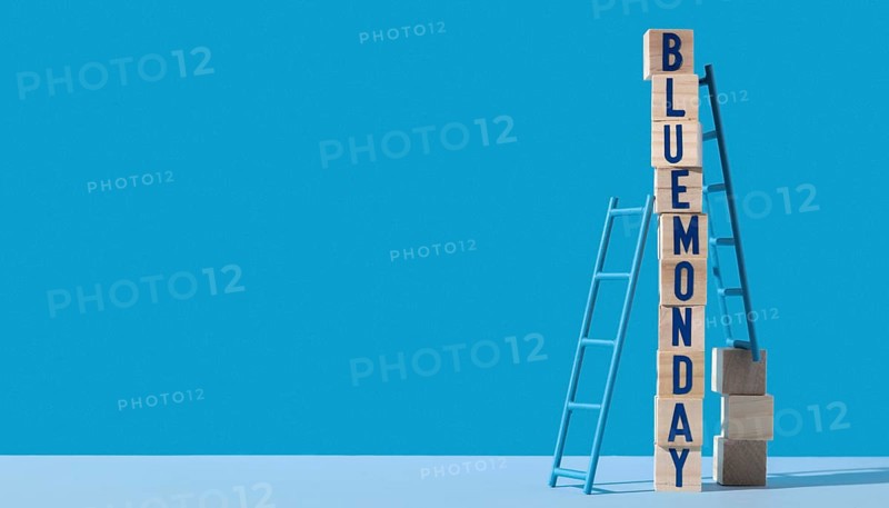 Blue monday with wooden cubes ladders copy space
