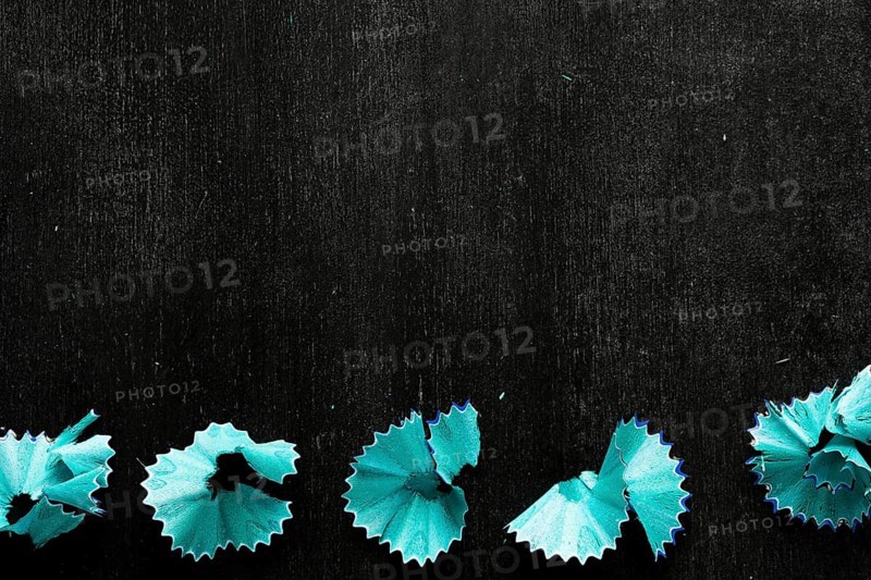 Blue pencil chips black desk
