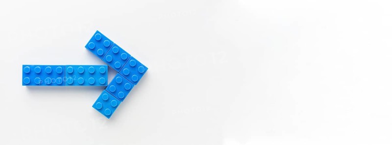 Blue toy arrow with copy space
