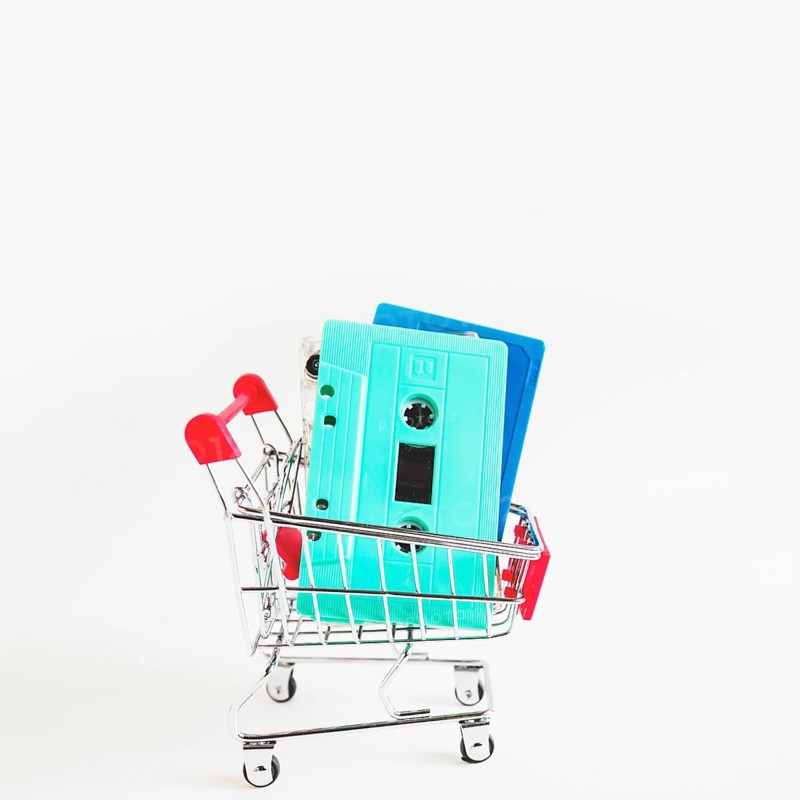 Blue turquoise cassette tapes shopping cart isolated white background