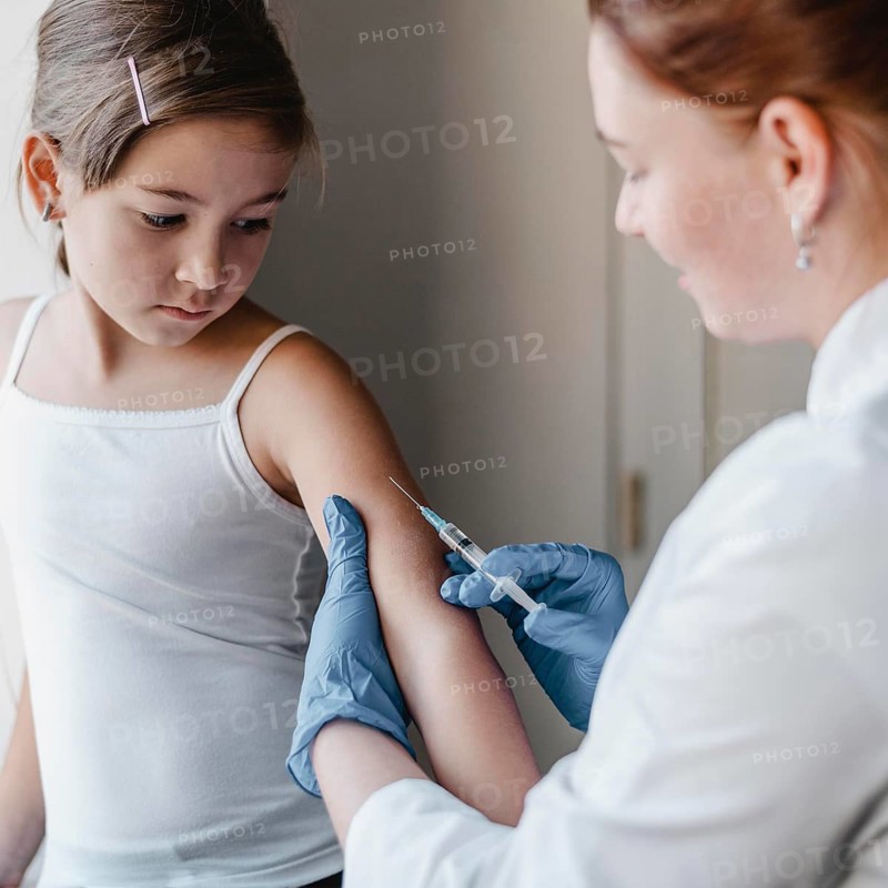Child doctor getting vaccine