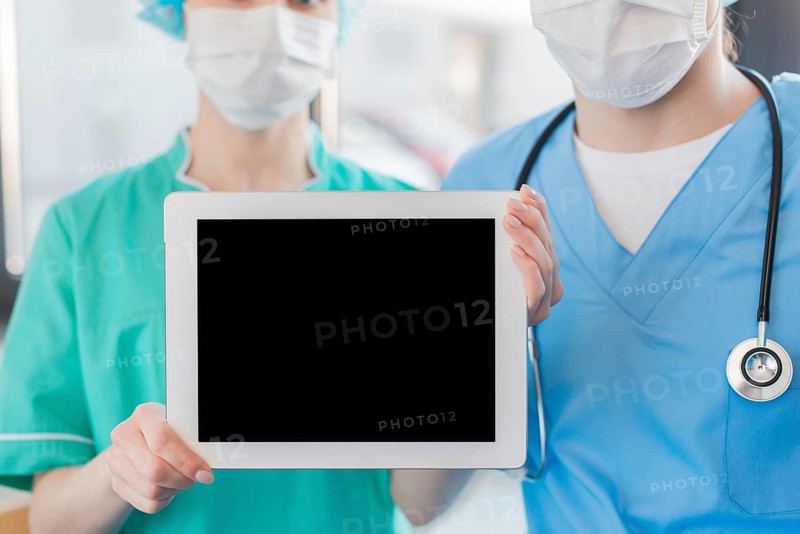 Close up nurses holding chalkboard