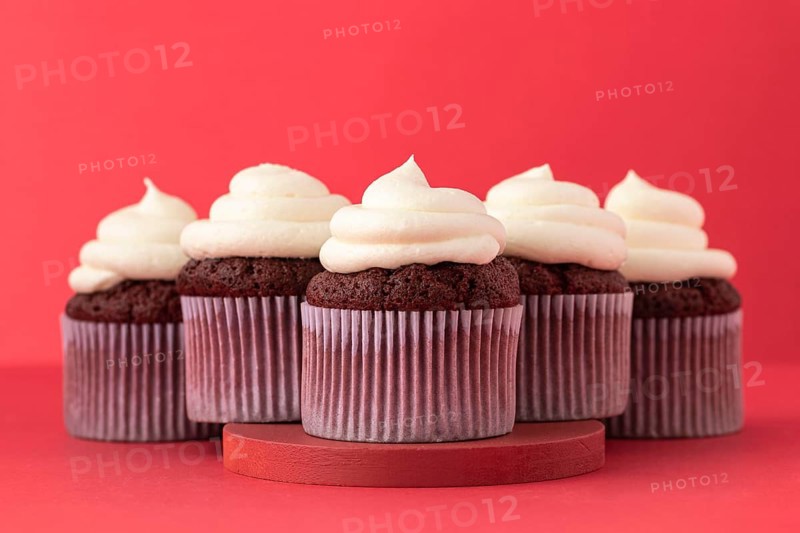 Delicious cupcakes with cream arrangement