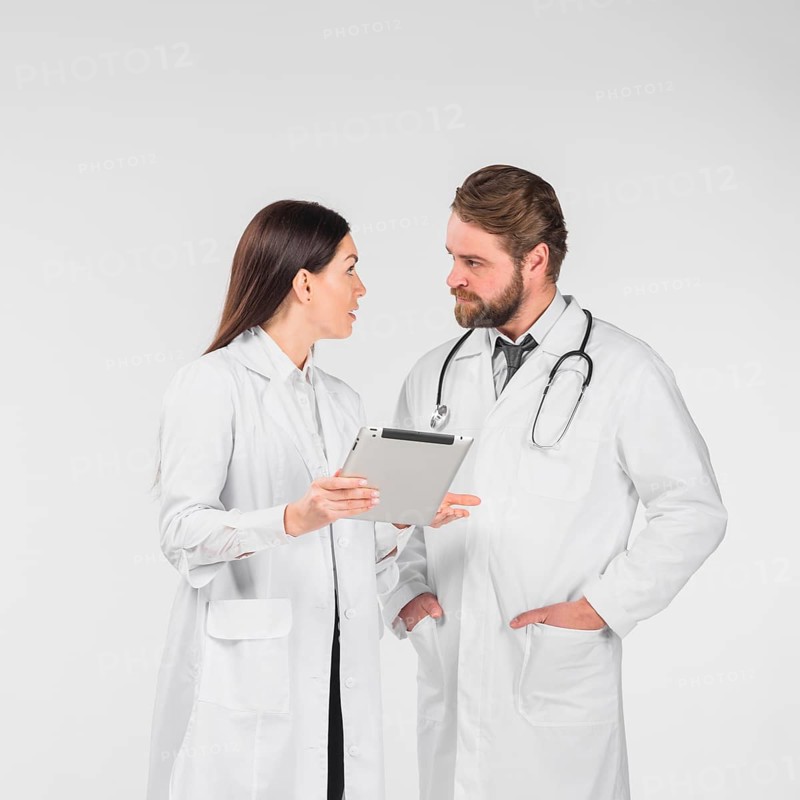 Doctors female male discussing looking each other