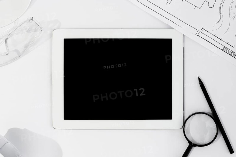 Flat lay arrangement with tablet white background
