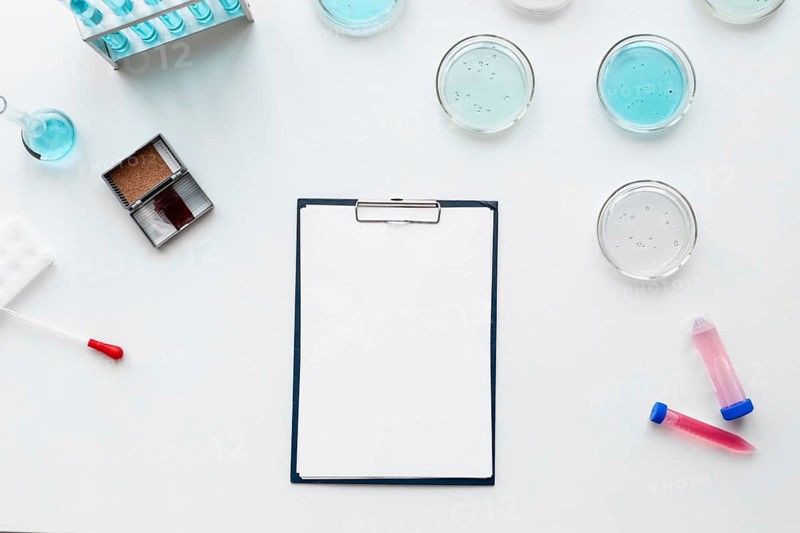 Flat lay lab equipment clipboard