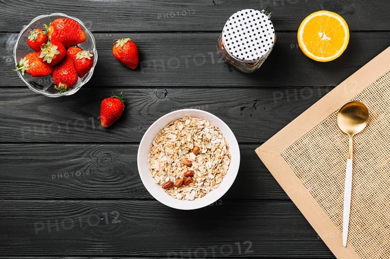 Fresh delicious breakfast with fruits textured wooden plank
