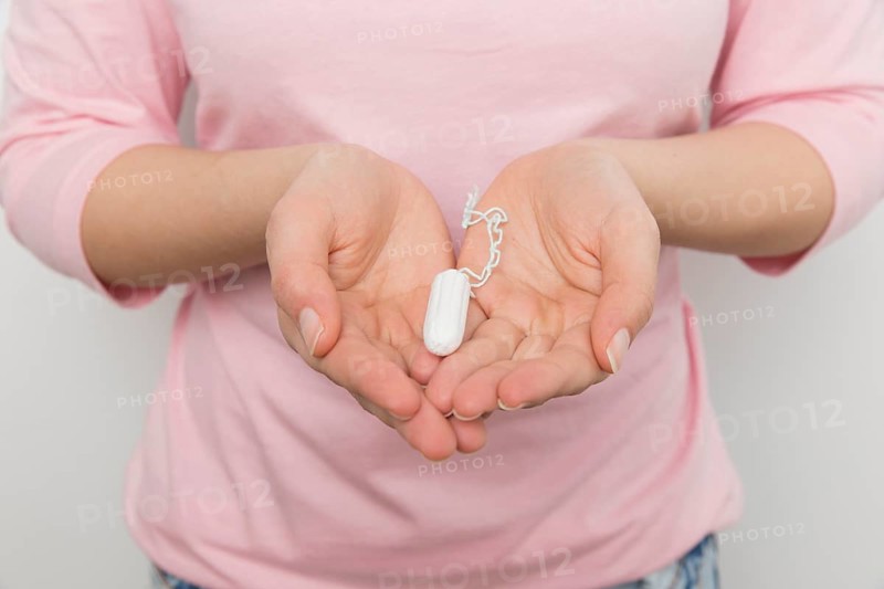 Girl holding clean tampon