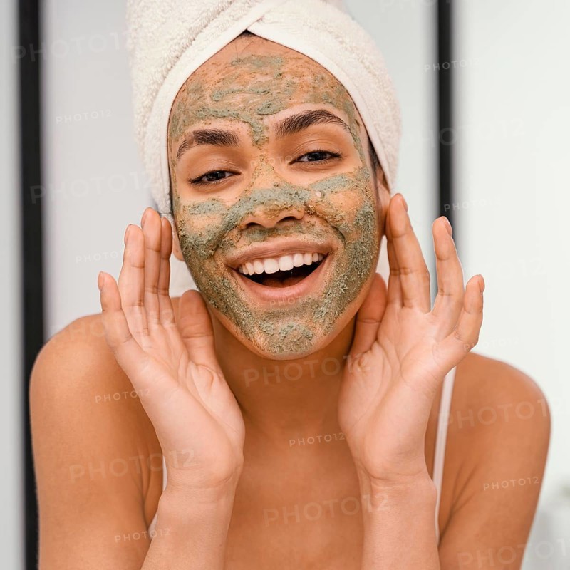 Happy woman having homemade mask her face