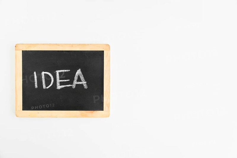 Idea text written slate white background
