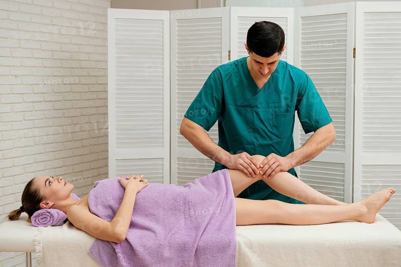 Medium shot man massaging knee