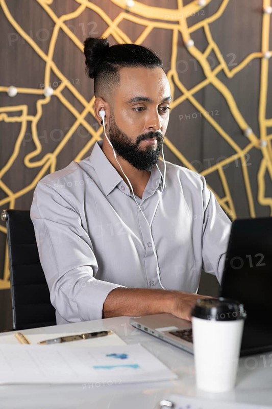 Medium shot man working with earphones