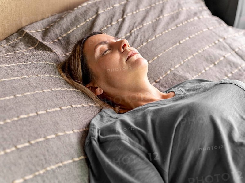 Medium shot woman laying bed
