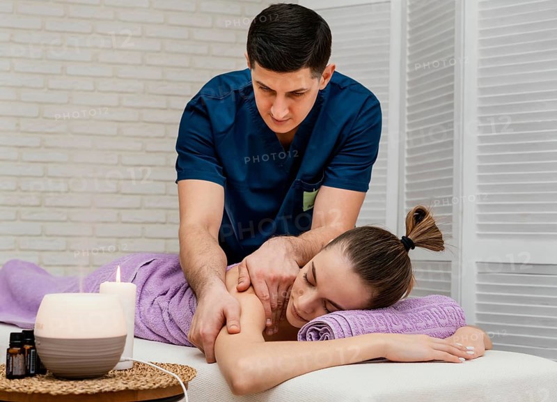 Medium shot woman receiving massage