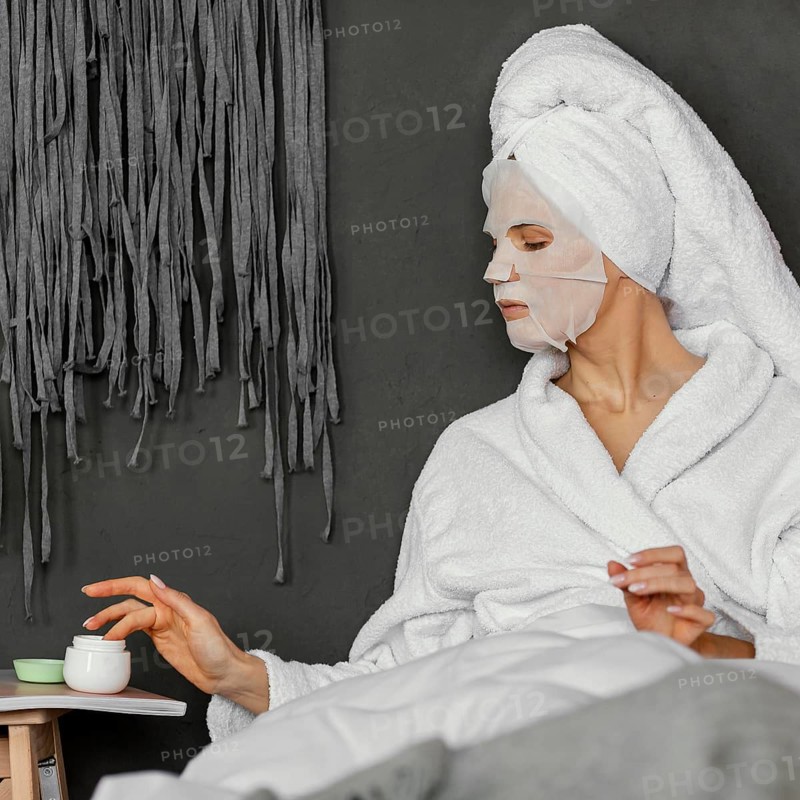Medium shot woman with face cream