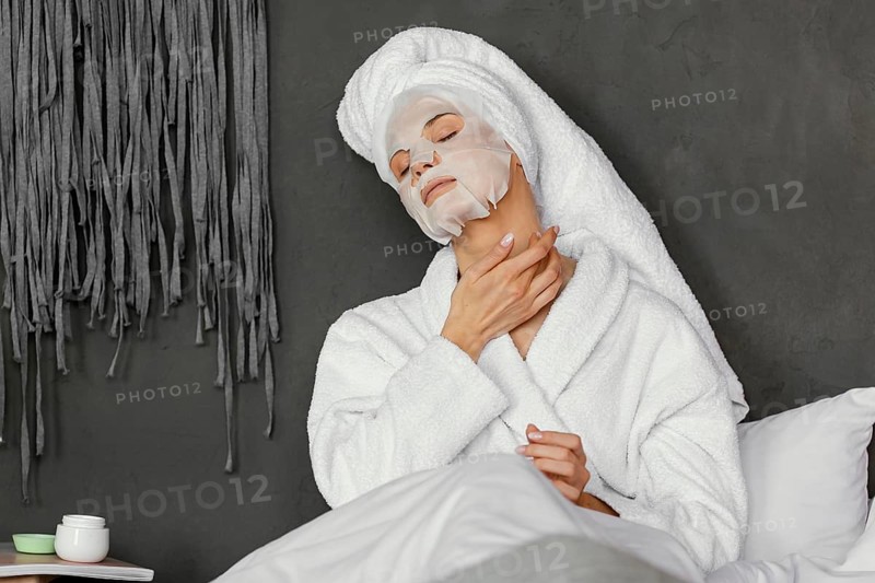 Medium shot woman with facial mask