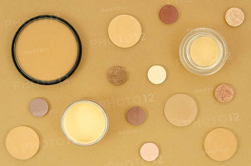Nude make up products beige background
