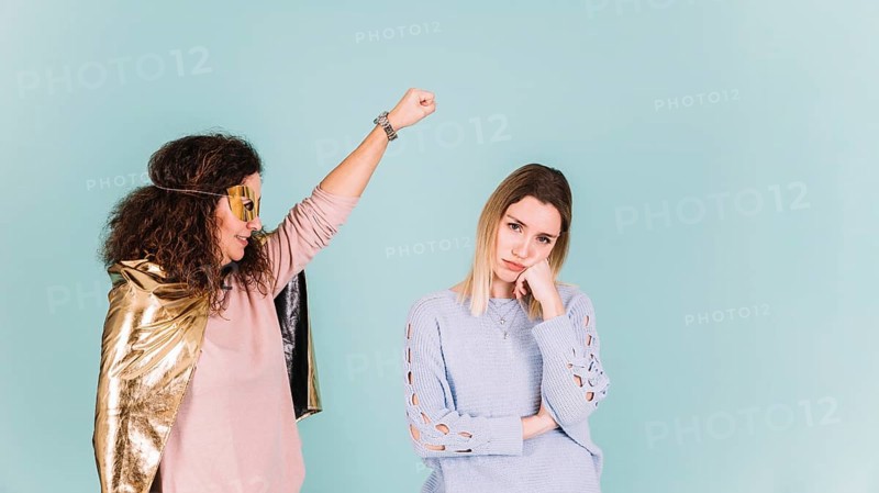 Superhero mother near bored daughter