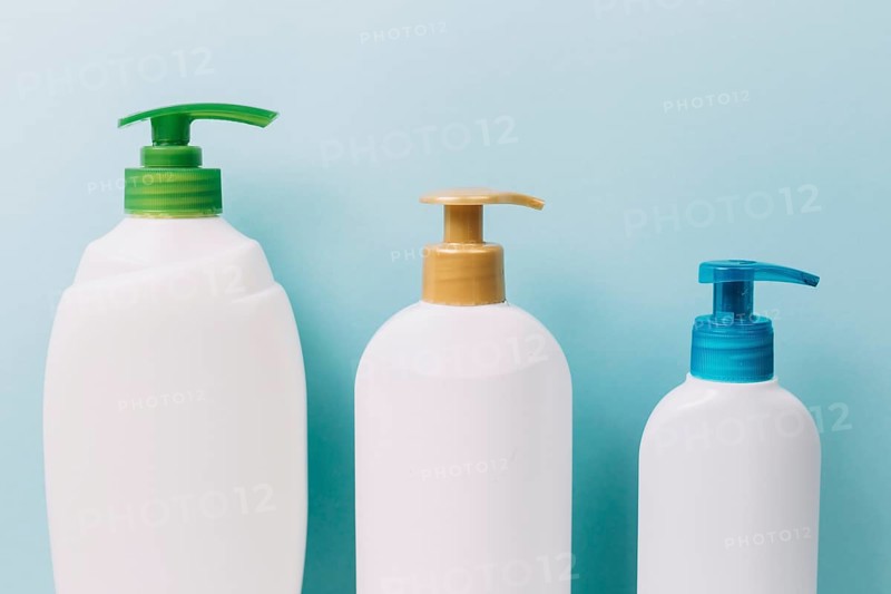 Three bottles with bright pumps