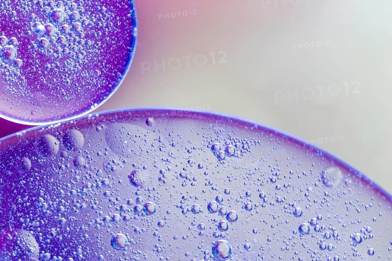 Translucent oil drops water blurred background