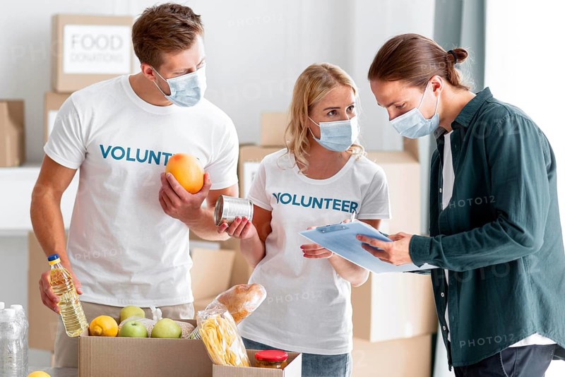 Volunteers helping packing donations world food day